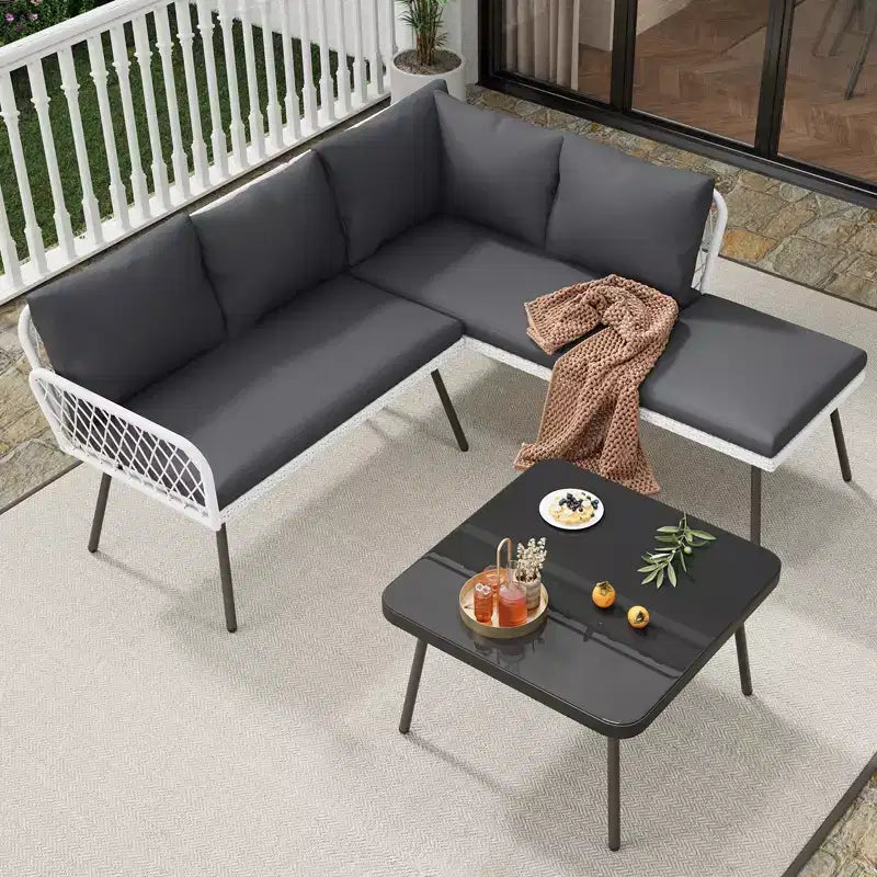 Set di mobili da esterno a L in vimini, divano sezionale da patio a 4 pezzi con rattan fatto a mano, set divano da conversazione con tavolino da caffè, pouf per giardino
